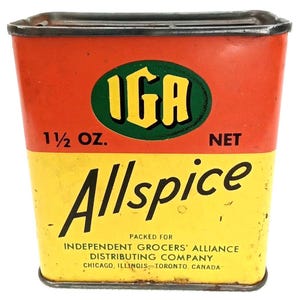 May include: Vintage rectangular spice tin with a red and yellow color scheme. The tin features the text "IGA" in a green oval, "Allspice" in large black letters, and "1 1/2 OZ. NET". The bottom of the tin reads "PACKED FOR INDEPENDENT GROCERS' ALLIANCE DISTRIBUTING COMPANY CHICAGO, ILLINOIS-TORONTO, CANADA."