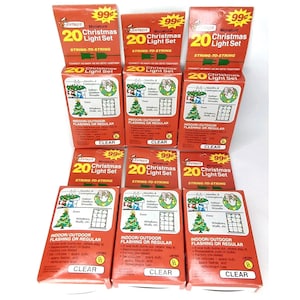 May include: Nine identical rectangular boxes of Joybrite miniature Christmas light sets. Each red and white box features the text 20 Christmas Light Set, illustrations of holiday decorations, and indicates the lights are clear.