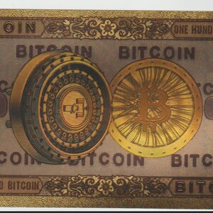 May include: A decorative Bitcoin bill with gold and brown tones. The bill features two Bitcoin coin designs and the word "Bitcoin" repeated multiple times. The number "100" is displayed on the bill, along with the text "ONE HUNDERD BITCOIN".