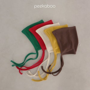 May include: Five baby bonnets in different colors: green, red, white, yellow, and brown. The bonnets are made of soft fabric and have ties that can be tied under the chin.