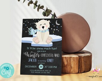 May include: A black chalkboard style invitation with a white polar bear wearing a blue and white scarf sitting on a blue and white ice floe. The invitation says "It'll be snow much fun! Join us in a Winter ONEDERLAND Jacob is turning ONE! Saturday December 20 at 3:00 PM 123 N. Millbrook Rd, Apex, GA RSVP, Maddie 123-456-7890"