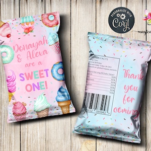 May include: Pink and blue party favor bags with a sweet theme. The front of the bag features a donut, ice cream cones, cupcakes, and sprinkles. The text on the front reads "Donayah & Alexa are a SWEET ONE!" The back of the bag has a nutrition facts label and the text "Thank you for coming".
