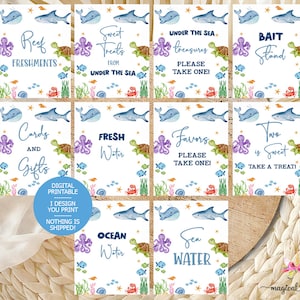 May include: A set of ten printable signs for a baby shower or birthday party with an under the sea theme. The signs feature an octopus, a turtle, a whale, and a shark. The signs have text that says "Sweet Treats from Under the Sea", "Under the Sea Treasures Please Take One", "Bait Stand", "Cards and Gifts", "Fresh Water", "Favors Please Take One", "Two is Sweet Take a Treat", "Ocean Water", and "Sea Water".