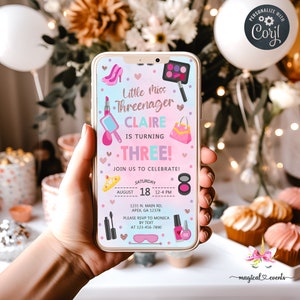May include: A pink and blue smartphone screen with a birthday invitation for a girl named Claire turning three. The invitation features a makeup theme with lipstick, eyeshadow, and a purse. The text reads "Little Miss Threenager Claire is turning Three! Join us to celebrate! Saturday, August 18, 12-4 PM. 1231 N. Main Rd, Apex, GA 12378. Please RSVP to Monica by text at 123-456-7890."