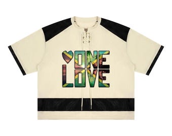 Unisex Raglan Sleeve Mesh Boxy One Love Reggae Streetwear T-Shirt in a range of sizes carnival apparel and urban reggae fashion on the beach