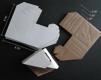 May include: Three cardboard boxes, two are white and one is brown. The white boxes are 5.75 inches wide and 5.75 inches tall. The brown box is 2 inches wide, 1.5 inches tall, and 1 inch deep.