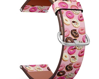 May include: Pink leather watch band with a donut pattern. The band has a silver buckle.