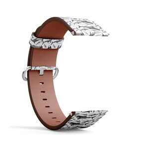 May include: A white leather watch strap with a brown leather band and a pattern of sharks. The strap has a silver buckle and a silver loop.