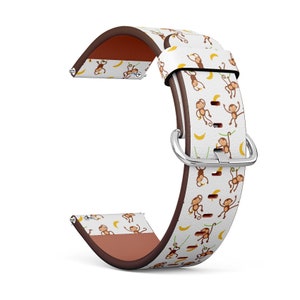 Peut inclure: Un bracelet de montre en cuir blanc et marron avec un motif de singes se balançant sur des lianes et tenant des bananes. Le bracelet est conçu pour une montre connectée.