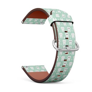 May include: A light green and brown watch band with a pattern of white teeth. The band has a silver buckle.