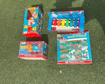 Colección de 4 juguetes vintage de Fisher Price con cajas originales de los años 70