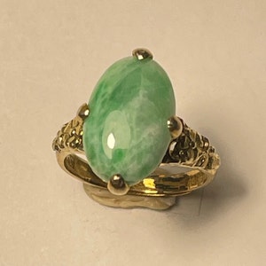 Antique 15 mm x 10 mm Burma jade not treated Sterling silver ring     14 K gold plated adjustible size from China circa 1970.