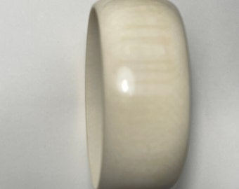 Vintage carved white coral bangle bracelet 28 mm wide oval shape. The diameter vary in size please request we will try to find one to fit.
