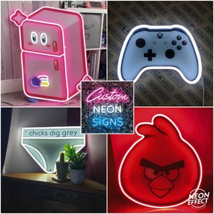 May include: A collage of custom neon signs, including a pink refrigerator, a white video game controller, a white underwear with the text "chicks dig grey", and a red angry bird.