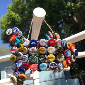Fish Collage beer bottle cap art by Becky. Handpicked beer bottle caps crafted into a fish. Custom pieces available upon request!