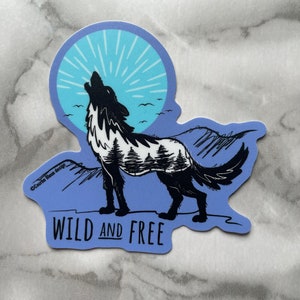 Wild and free - wild wolf howling at the moon - Vinyl sticker