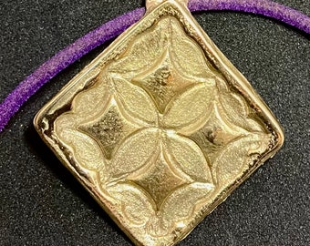 Commande spéciale CA. Pendentif en bronze fait main, représentant un symbole de la langue africaine