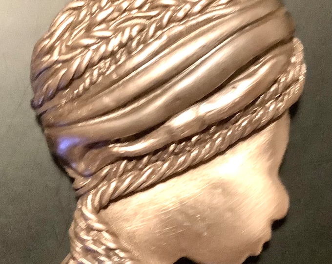 AC18. Head of an African woman, with  scarf wound round her head, handmade in rose bronze, large pendant