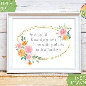 May include: White framed art print with the text "Roses are red, Knowledge is power, Go smash the patriarchy, You beautiful flower." The print features a gold oval design with watercolor flowers in pink and orange.