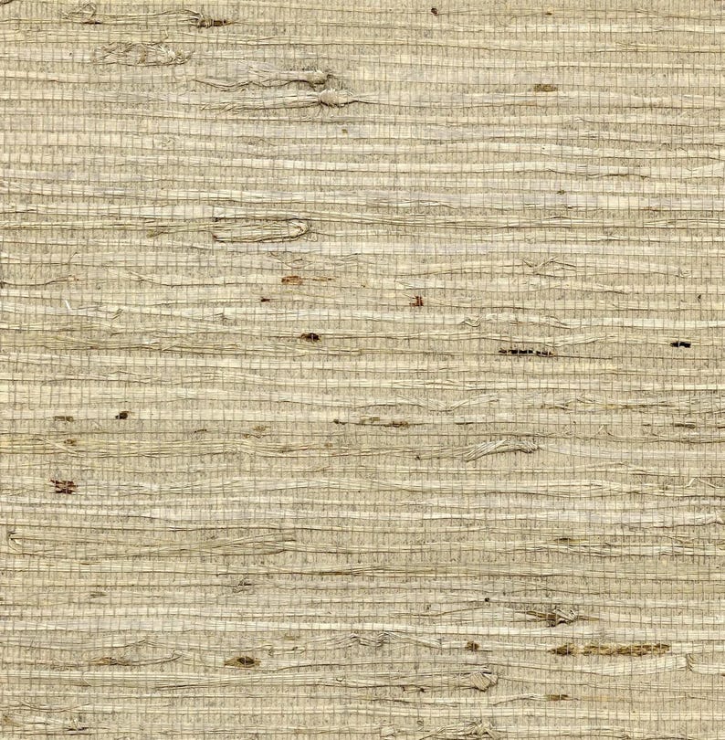 Puede incluir: Primer plano de un material tejido beige texturizado. El tejido es horizontal con imperfecciones visibles y variaciones de color, creando una apariencia natural y org&aacute;nica. El material parece ser un tipo de fibra natural.