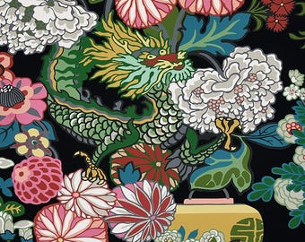 May include: A green dragon with yellow and gold accents is surrounded by colorful flowers and leaves. The dragon is holding a yellow lantern with a gold symbol on it. The background is black.