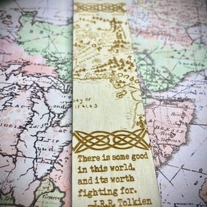 May include: Wooden bookmark with a map of Middle-earth and a quote from J.R.R. Tolkien: "There is some good in this world, and it's worth fighting for."
