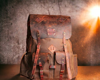 May include: A brown leather and canvas backpack with multiple pockets and straps. The backpack has a distressed look and is made of high-quality materials.