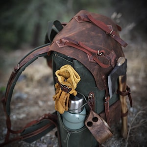 camping backpack with axe holder, handmade camping backpack, camping backpack with axe holder, camping backpack with waist belt , camping backpack with shoulder belt, leather camping backpack with axe holder, leather