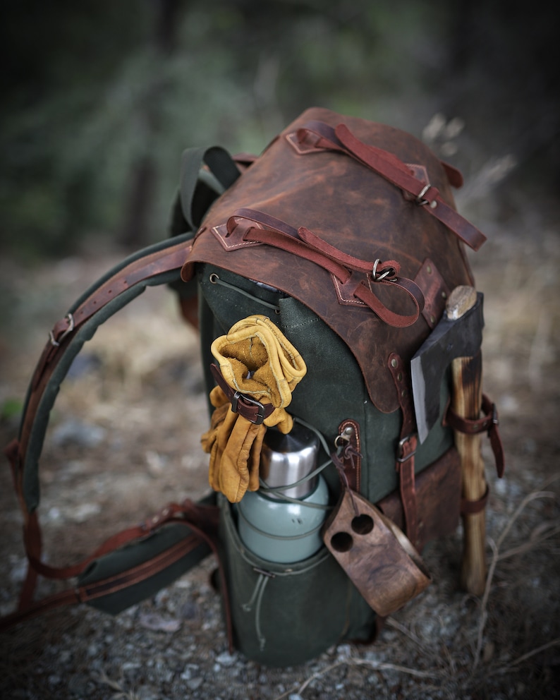 camping backpack with axe holder, handmade camping backpack, camping backpack with axe holder, camping backpack with waist belt , camping backpack with shoulder belt, leather camping backpack with axe holder, leather