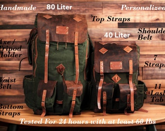 May include: Two handmade backpacks, one 80-liter and one 40-liter, with green canvas and brown leather accents. Features include top straps, shoulder belts, and multiple lash tabs. The larger pack has an axe/tripod holder and waist belt. The text reads "Handmade" and "Personalized".