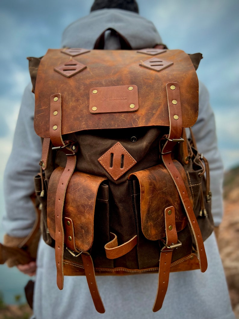 camping backpack with axe holder, handmade camping backpack, camping backpack with axe holder, camping backpack with waist belt , camping backpack with shoulder belt, leather camping backpack with axe holder, leather  camping backpack with axe holder