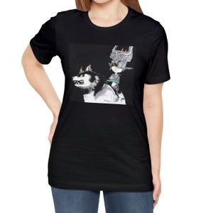 Puede incluir: Camiseta negra con una ilustración en blanco y gris de un lobo con un personaje del videojuego "The Legend of Zelda: Twilight Princess" montado en su espalda.