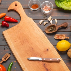 Beautiful cherry wood cutting board with handle