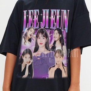 May include: Black oversized t-shirt featuring a graphic print of a group of women with the text "LEE JIEUN" in a pink and blue gradient.