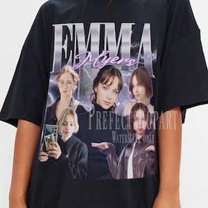 May include: Black t-shirt with a graphic of a person and the text "EMMA Myers" in a stylized font. The graphic includes multiple images of the person. The text "PREFECT" and "WATERMARK ONLY" are also visible.