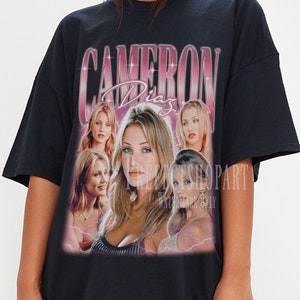 May include: Black oversized t-shirt with a graphic print of Cameron Diaz in a pink and white design. The text "Cameron Diaz" is printed in pink and white.