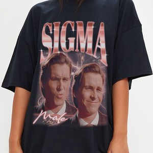 May include: Black oversized t-shirt with a graphic print of two men's faces and the text "SIGMA Male" in pink.