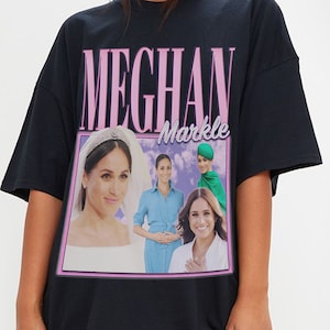 May include: Black oversized t-shirt with a graphic print of Meghan Markle in various photos. The text "Meghan Markle" is printed in pink on the shirt.