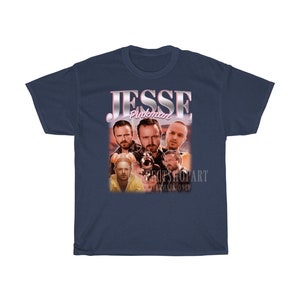 May include: Navy blue t-shirt with a vintage-style graphic of Jesse Pinkman from the TV show Breaking Bad. The graphic features multiple images of Jesse Pinkman in different poses.