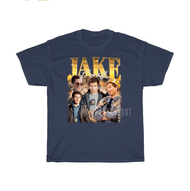 May include: A navy blue t-shirt with a gold graphic of Jake Peralta from the TV show Brooklyn Nine-Nine. The graphic features Jake Peralta in different poses, including wearing a crown.