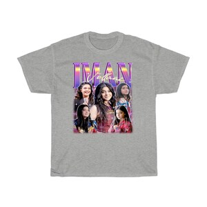 May include: A gray t-shirt with a retro-style graphic featuring a group of girls with the text "IMAN VIBES" in purple and pink.