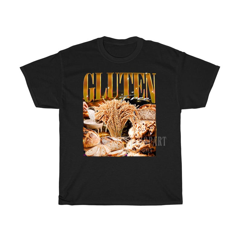 May include: Black t-shirt with a graphic featuring the words "GLUTEN FREE" in gold lettering. The graphic includes images of various types of bread, wheat, and a bowl of flour, all in warm, natural tones.