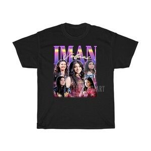 May include: Black t-shirt with a retro-style graphic featuring a group of people with the text "Iman Vellani" in a colorful, neon font.