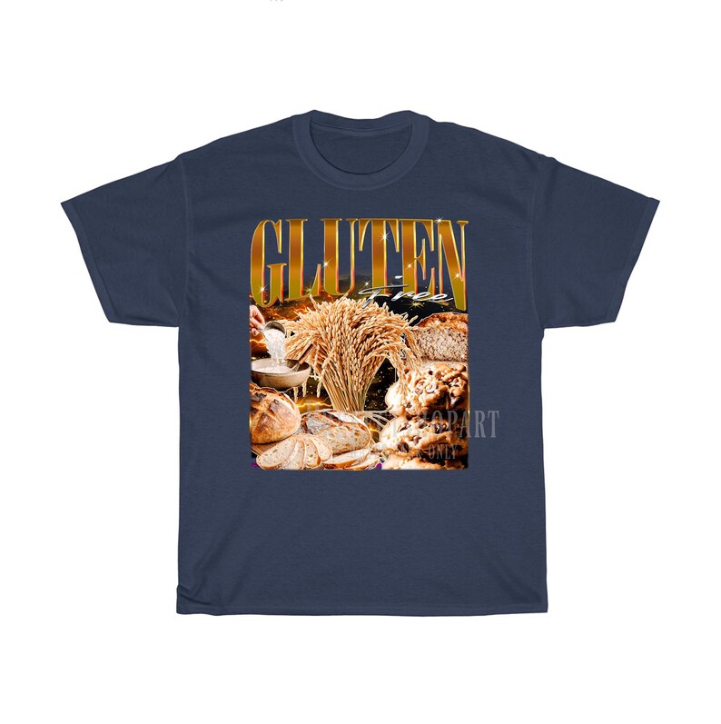 May include: A navy blue t-shirt with a gold-coloured graphic that reads "GLUTEN FREE". The graphic shows different types of bread and wheat, indicating a theme of gluten-free products.