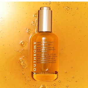 May include: A glass bottle of Youthbomb 360&deg; Face Lift Serum (SO01) with an exclusive Biolog-Elastic Complex. The bottle is gold and has a dropper top. The text on the bottle reads "To help firm, lift and tighten, visibly soften lines and wrinkles, boost radiance and enhance luminosity."