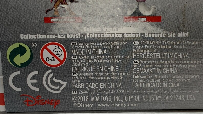 May include: A product package with text in multiple languages, including English, French, and Spanish. The package includes a warning about small parts and choking hazards, and states "Made in China". The Disney logo is visible.