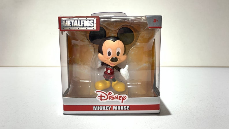 Mickey mouse figure made of metal. 6 centimeters heigh. New in sealed box.