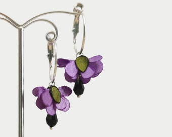 Flower-shaped satin pendant earrings with purple petals and crystal drop
