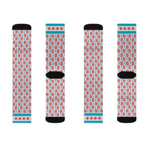 May include: Three pairs of white socks with a red and blue pattern. The pattern features a repeated image of a stick figure doing a fencing pose. The socks have a blue band with three red stars at the top.