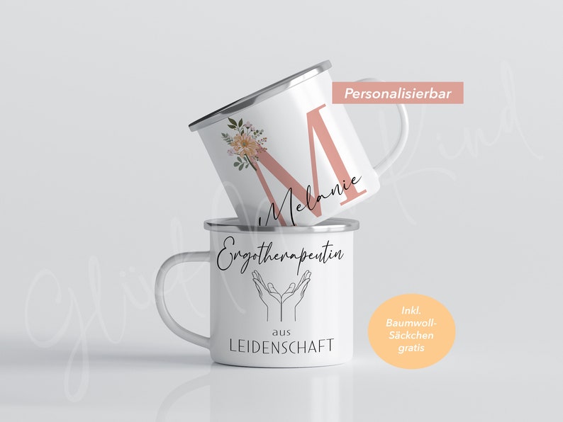 May include: Two white enamel mugs with silver lids. The top mug has a pink letter M with floral accents and the name "Melanie" written below. The bottom mug has the text "Emgotherapeutin aus LEIDENSCHAFT" and a graphic of two hands with palms facing up. The text "Ink. Baumwoll-S&auml;ckchen gratis" is in a circle on the right side of the image.